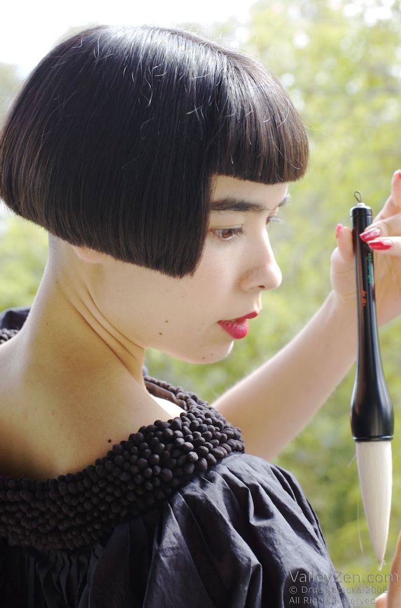 AVOID: Severely Undercut Angled Bob with Blunt Bangs