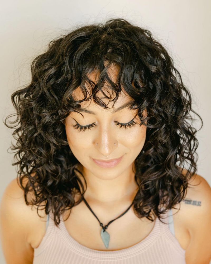 Voluminous Curly Shoulder-Length Cut