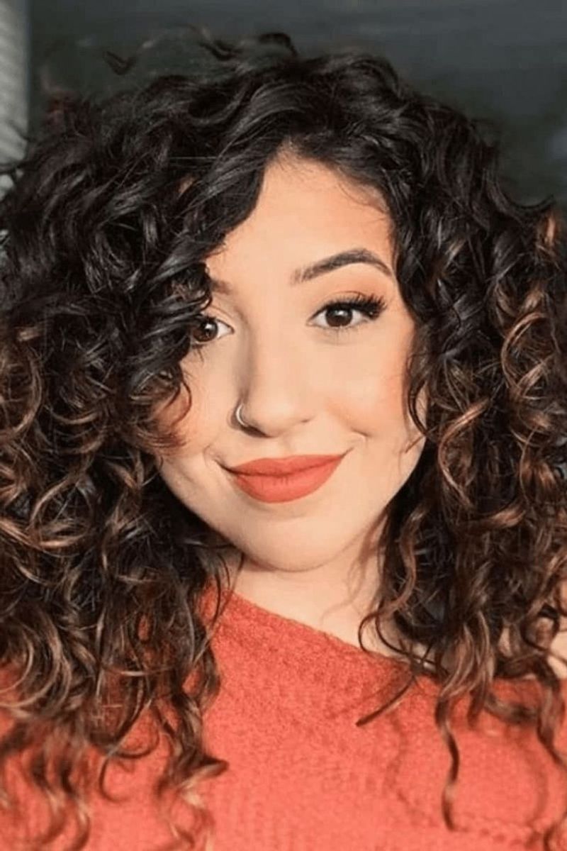 Voluminous Curls with Side-Swept Bangs