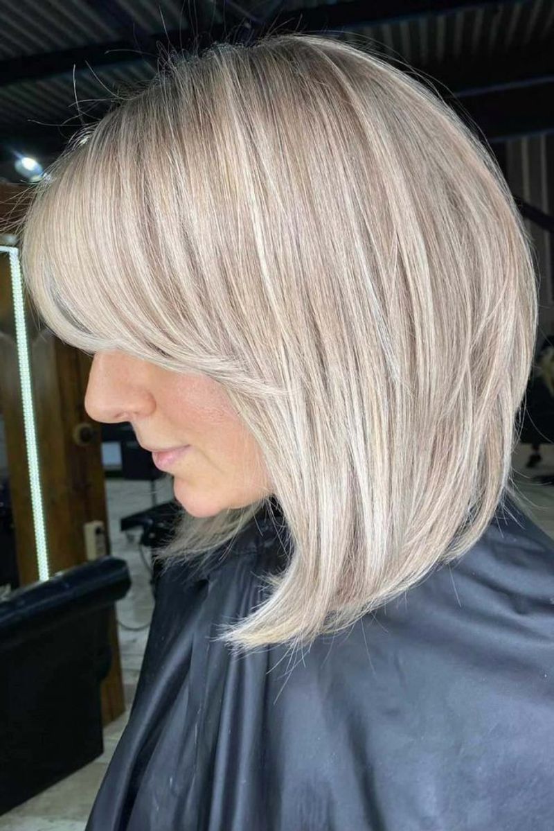 Sleek Mid-Length Cut with Side Part