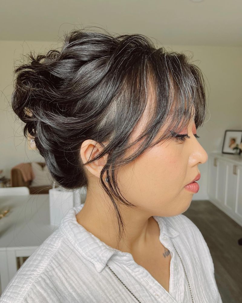 Wispy Updo with Face-Framing Tendrils