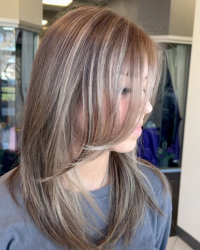 Mid-Length Cut with Face-Framing Layers