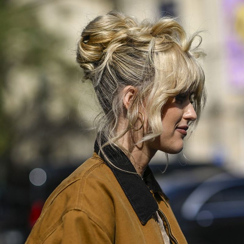 Voluminous Top Knot with Loose Tendrils