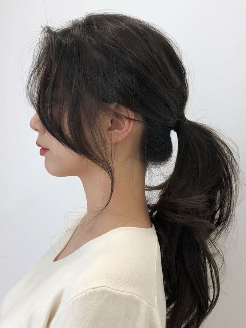 Low Ponytail with Face-Framing Bangs