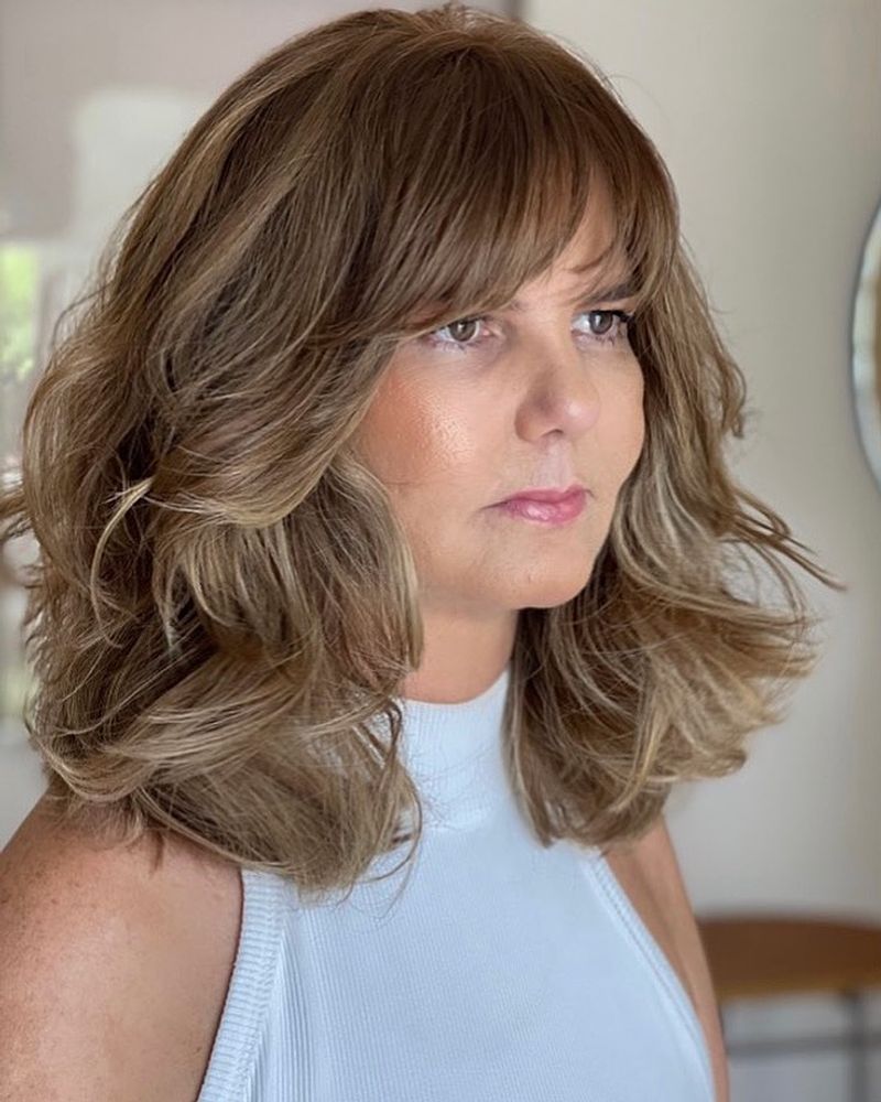 Layered Mid-Length Cut with Bangs