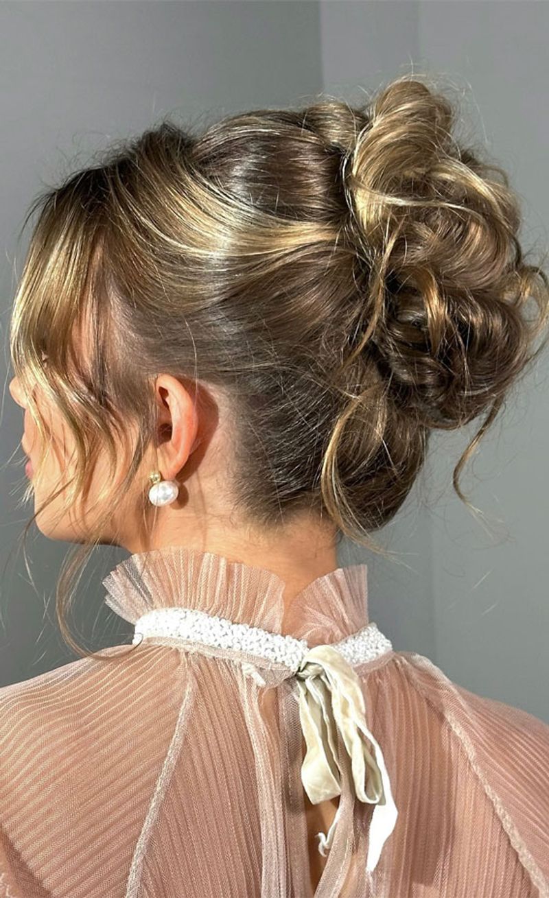 Elegant Updo with Loose Tendrils