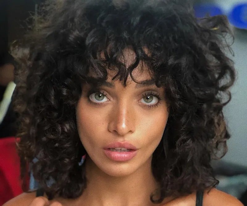 Sagittarius: Wild Curly Shag with Bangs