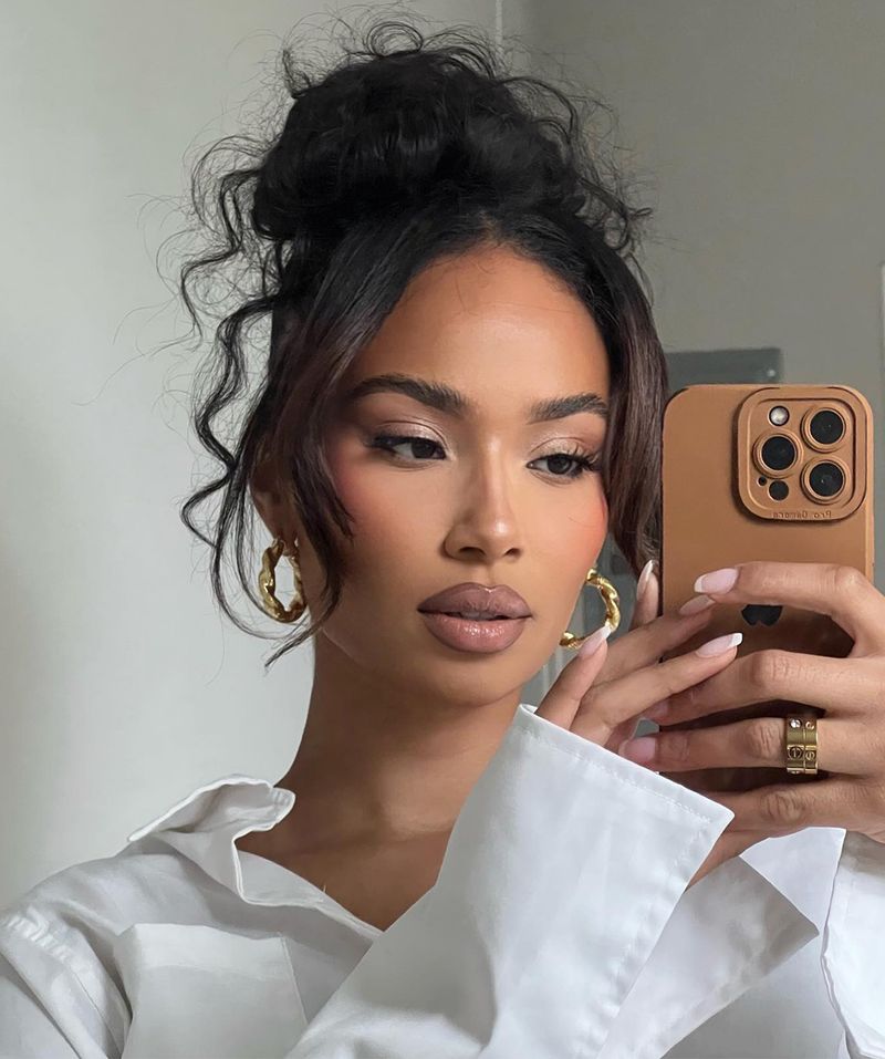 Messy Top Knot with Face-Framing Pieces